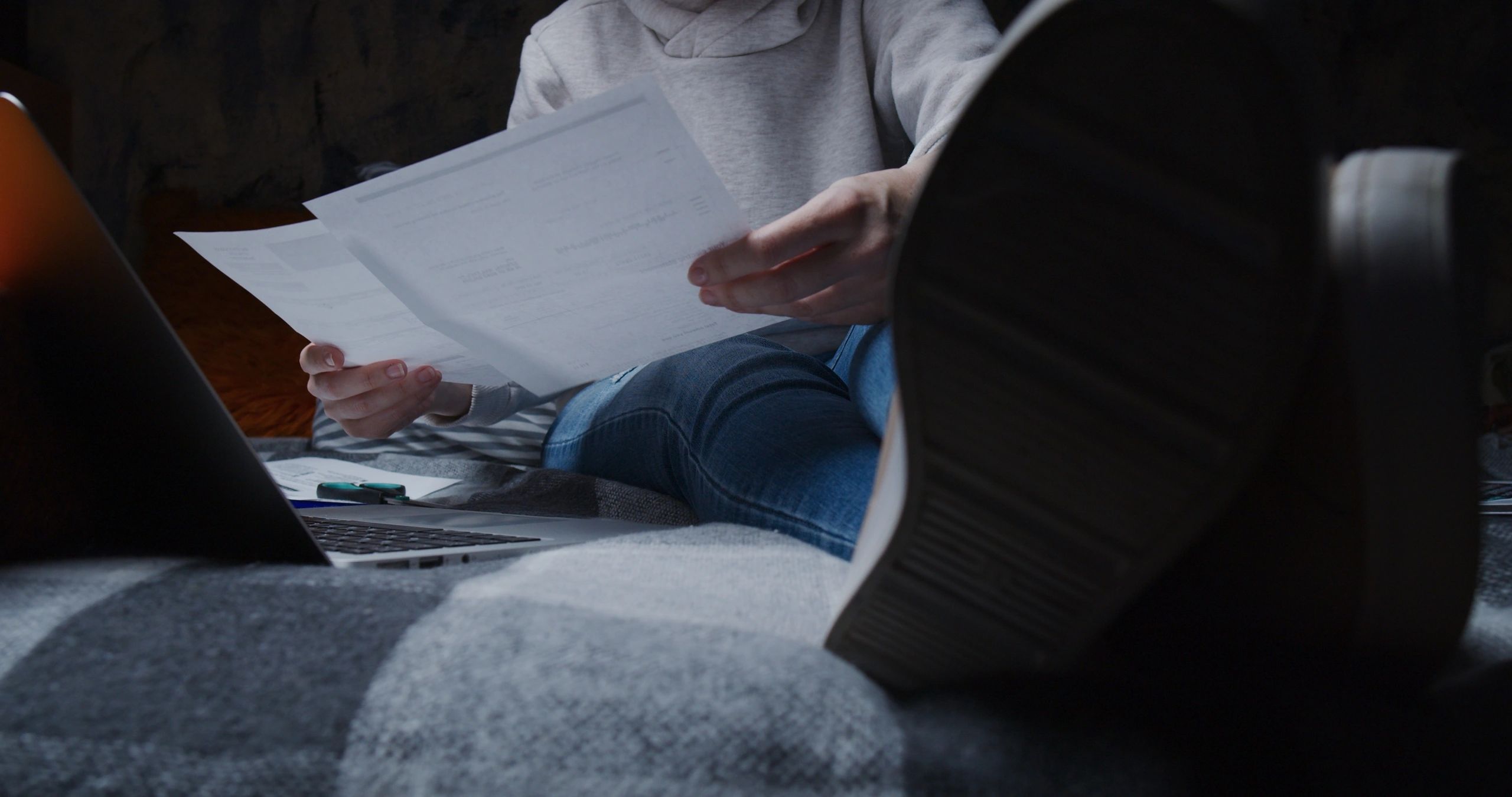 Homeowner organizing financial and property paperwork at home