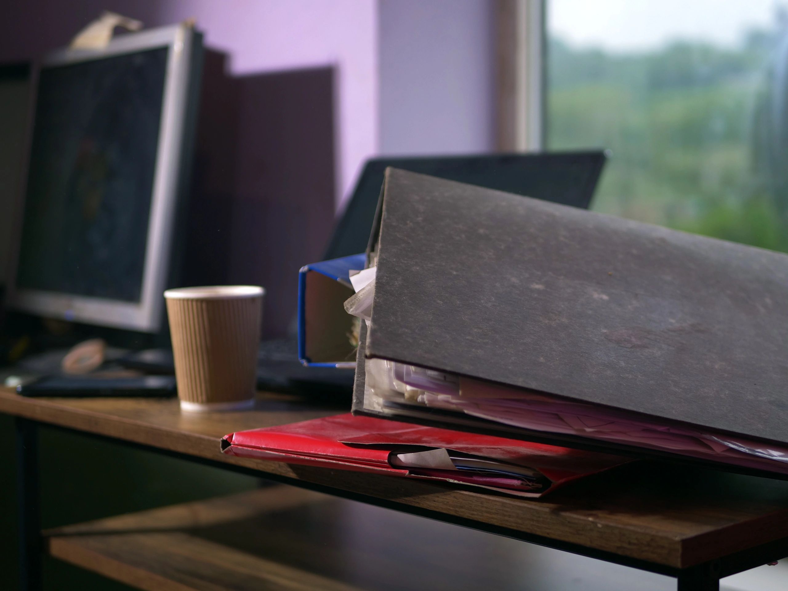 Property files and ownership documents on a desk