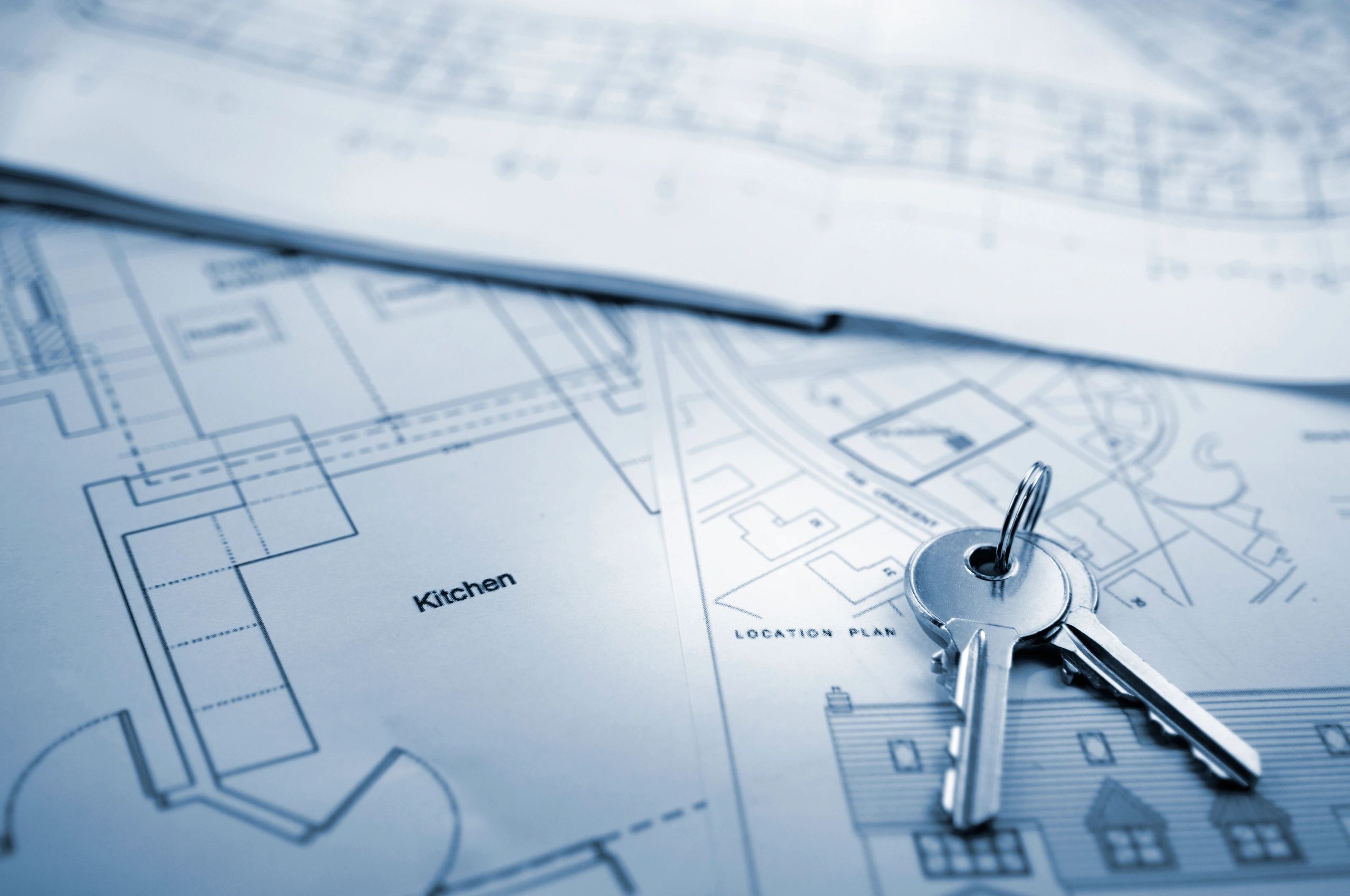 Keys on top of architectural house plans