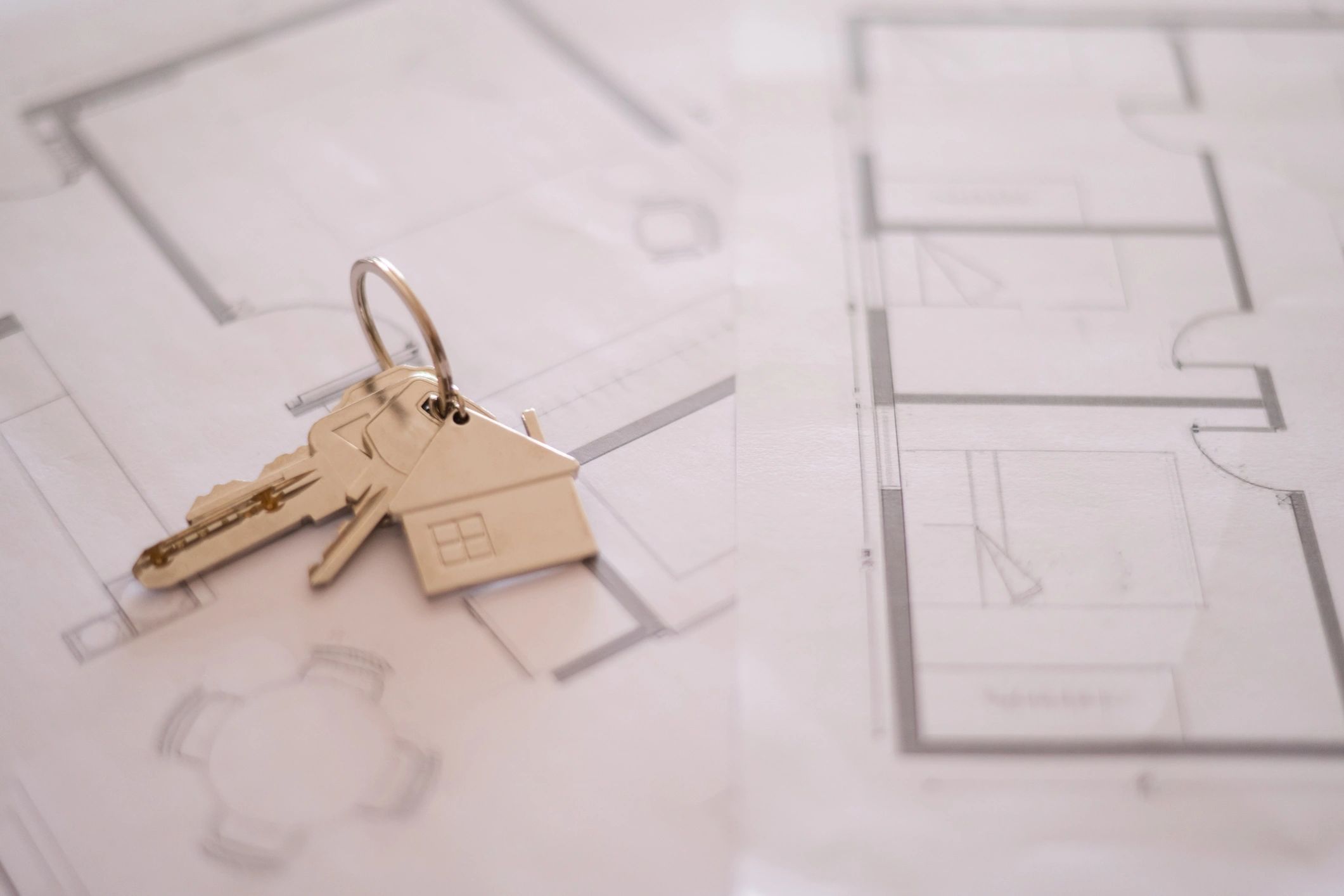 House keys on plans representing property ownership protection