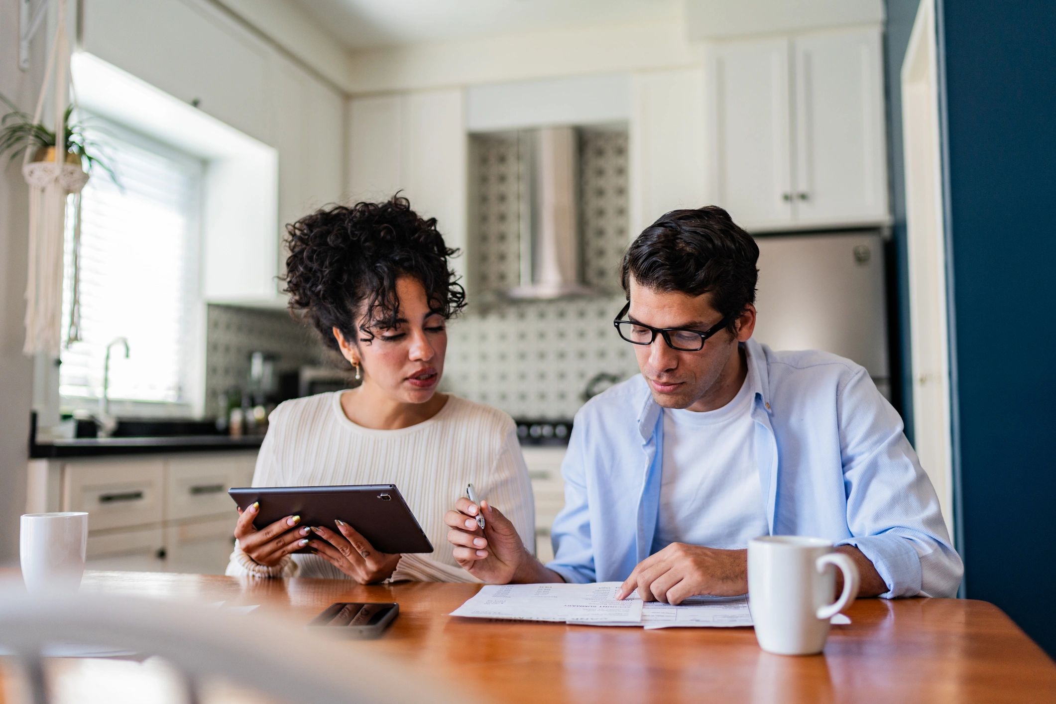 Homeowners reviewing important property documents together